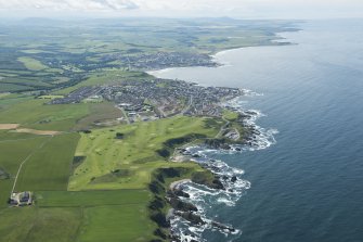 General oblique aerial view of the Royal Tarlair Golf Course with Macduff beyond, looking WSW.