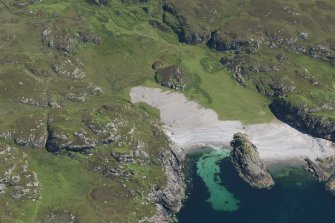 Oblique aerial view of Port na Curaich, Iona, looking NE.