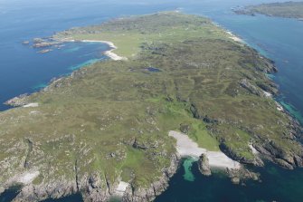 General oblique aerial view of Iona with Port na Curaich in the foreground, looking NNE.