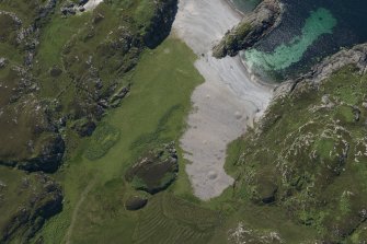 Oblique aerial view of Port na Curaich, Iona, looking S.