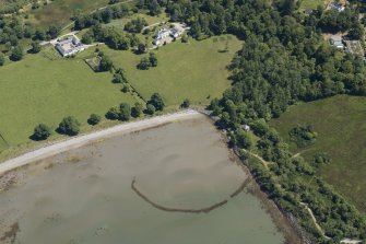 Oblique aerial view of the fish trap and Airds House Home Farm, looking ENE.