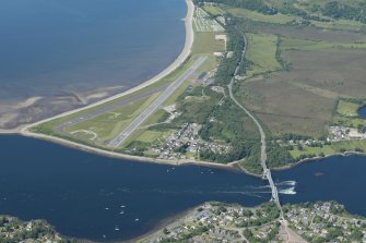 Oblique aerial view of Connel Airfield, looking NW.