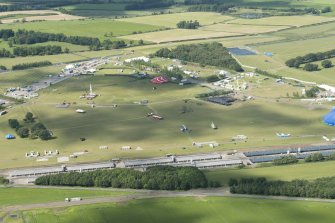 Oblique aerial view of Balado showing T in the Park, looking NNE.