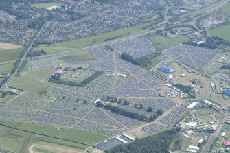 Oblique aerial view of camping at T in the Park, looking SE.