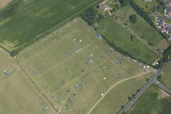 Oblique aerial view of a camp site at T in the Park, looking NE.