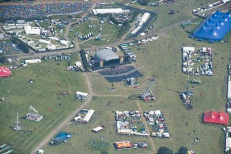 Oblique aerial view of T in the Park centred on the Main Stage, looking E.