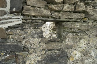 Detail of joist hole at wall head over entrance beside corbels