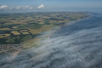 General oblique aerial view the East Neuk of Fife from Elie towards Crail with the haar on the Forth, looking NE.