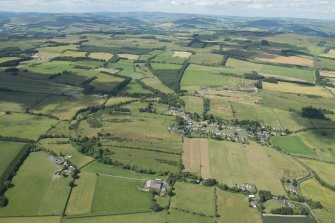 General oblique aerial view of Midlem village and the surrounding field pattern, looking NNW.