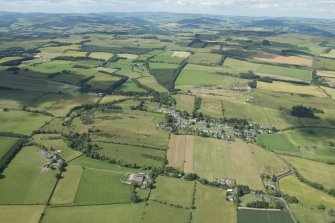 General oblique aerial view of Midlem village and the surrounding field pattern, looking NNW.