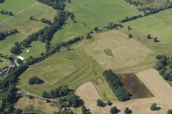 Oblique aerial view of Ardoch Roman fort, looking NNW.