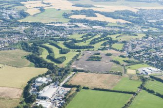 Oblique aerial view of Auchmill Golf Course, looking N.