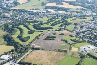 Oblique aerial view of Auchmill Golf Course, looking NNE.