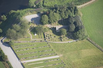 Oblique aerial view of Dyce Old Parish Church and Burial Ground, looking N.