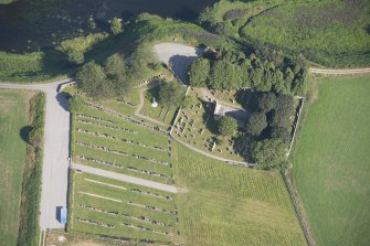 Oblique aerial view of Dyce Old Parish Church and Burial Ground, looking NNW.