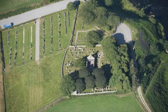 Oblique aerial view of Dyce Old Parish Church and Burial Ground, looking W.