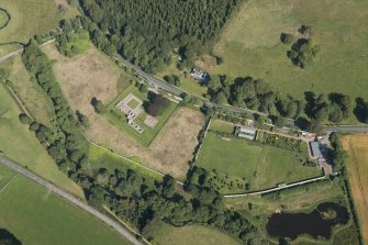 Oblique aerial view of Deer Abbey and walled garden, looking NNW.