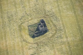 Oblique aerial view of Castle of Pittulie, looking E.