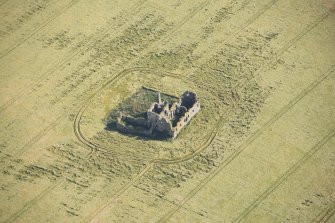 Oblique aerial view of Castle of Pittulie, looking NE.