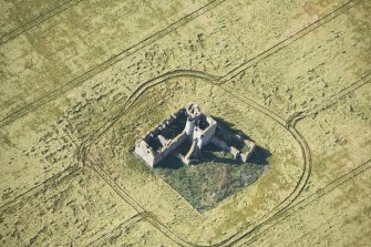 Oblique aerial view of Castle of Pittulie, looking SW.