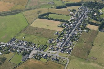 Oblique aerial view of New Aberdour, looking S.