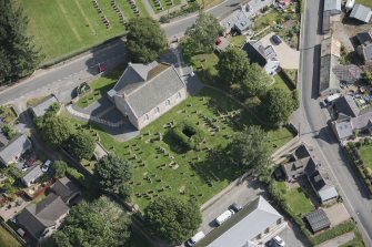 Oblique aerial view of Chapel of Garioch Parish Church, St Mary's Chapel and Old Parish Church, looking NE.