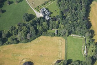 Oblique aerial view of Pitcaple Castle, laundry and walled garden, looking WSW.