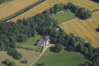 Oblique aerial view of Pitcaple Castle, laundry and walled garden, looking NNE.