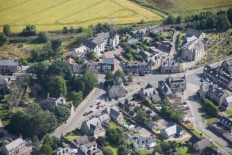 Oblique aerial view of Kintore Town House and Parish Church, looking NE.