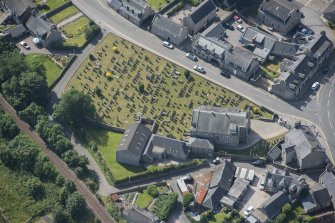 Oblique aerial view of Kintore Parish Church and churchyard, looking S.