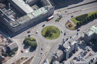 Oblique aerial view of Aberdeen Royal Infirmary and Woolmanhill Roundabout, looking E.
