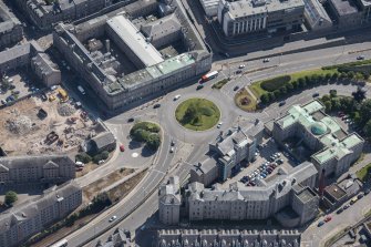 Oblique aerial view of Aberdeen Royal Infirmary and Woolmanhill Roundabout, looking ENE.