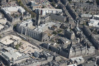 Oblique aerial view of Aberdeen Marischal College, Old St Andrew's Episcopal Church, Greyfriars Church and Minicipal Buildings, Tolbooth, looking NNE.