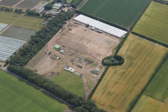 Oblique aerial view of the polytunnels at Windyhills, looking WSW.