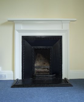 1st floor, south east bedroom dressing room, detail of fireplace