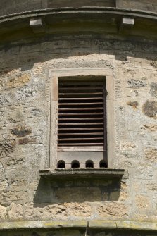 Detail of pigeon holes and vent above south entrance.