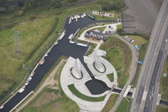 Oblique aerial view of The Kelpies, looking NW.