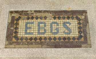 Detail of mosaic panel (EBGS, Edinburgh Burgess Golfing Society) on floor of verandah.