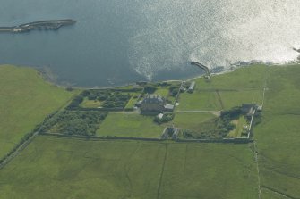 Oblique aerial view of Gardie House, Bressay, looking SW.