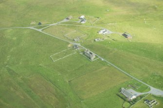 Oblique aerial view of Muness Castle, Unst, looking N.
