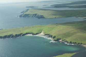 Oblique aerial view of The Garths, Unst, looking SSW.