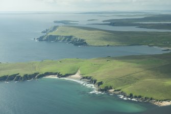 Oblique aerial view of The Garths, Unst, looking SSW.