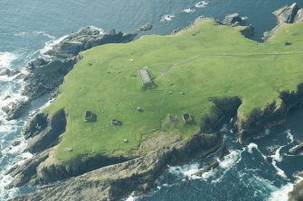 Oblique aerial view of The Garths, Lamba Ness, Unst, looking SE.