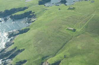 Oblique aerial view of The Garths, Unst, looking SE.