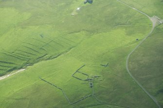 Oblique aerial view of Inner Skaw and The Garths, Unst, looking SE.