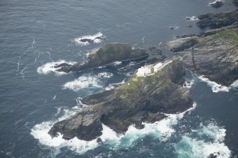 Oblique aerial view of North Unst Lighthouse, Muckle Flugga, looking SSE.