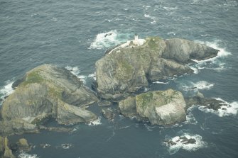 Oblique aerial view of North Unst Lighthouse, Muckle Flugga, looking NW.
