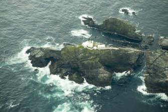 Oblique aerial view of North Unst Lighthouse, Muckle Flugga, looking SE.