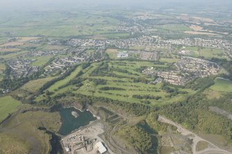 Oblique aerial view of Cochrane Castle Golf Course, looking W.