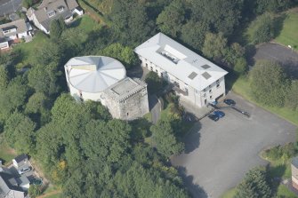 Oblique aerial view of Mearns Castle, looking N.